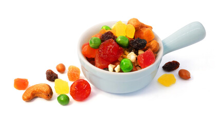 Mix dried fruit and nuts in a bowl isolated on white background.