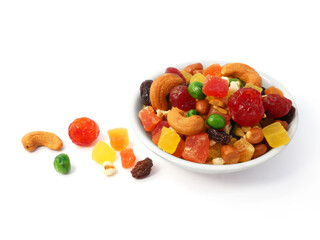 Mix dried fruit and nuts in a bowl isolated on white background.