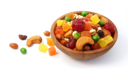 Mix dried fruit and nuts in a wooden bowl isolated on white background.