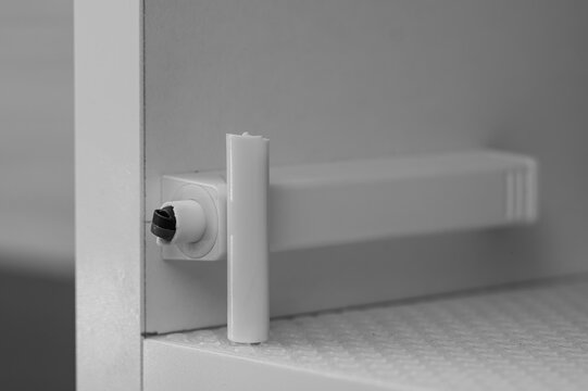 Broken tipon in white bathroom cabinets, cabinet system without handles