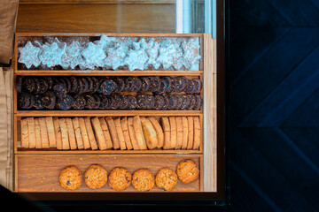 bakery shop cookies counter open box with cells sale products food concept pattern close up mock up background top view advertising