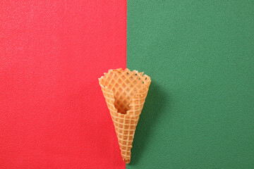 Empty Waffle Cone on Red and Green Background