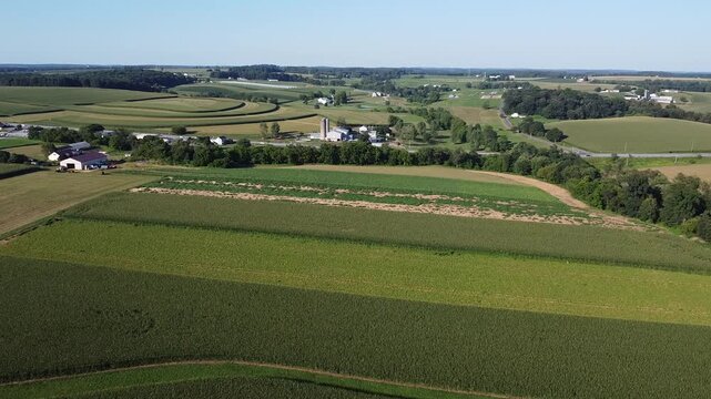 Aerial view of agricultural fields, barns and silos on farms in Cochranville, southeastern Pennsylvania