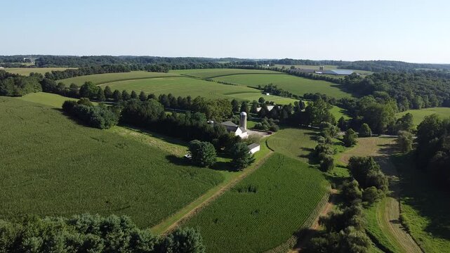 Aerial view of agricultural fields, barns and silos on farms in Cochranville, southeastern Pennsylvania