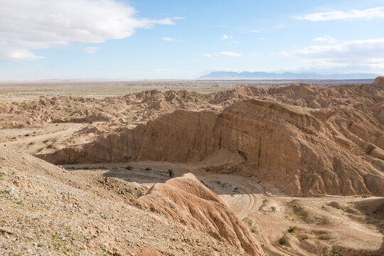 A dirt bike path in Borrego Badlands with clear blue sky
