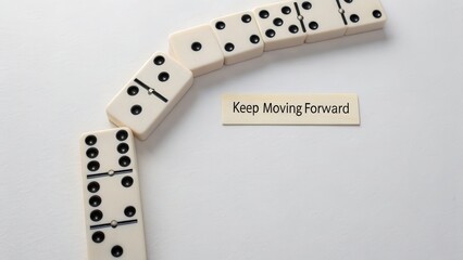 Domino tiles in curved line with motivational message