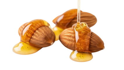 Almonds with honey isolated PNG, sweet nuts drizzled with golden honey for healthy snack and dessert ingredient