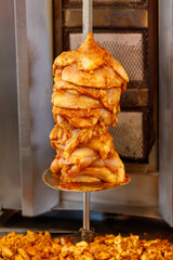 A piece of meat is being cooked on a grill