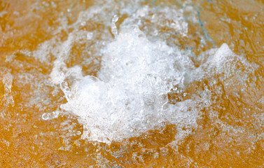 A small splash of water is in the air