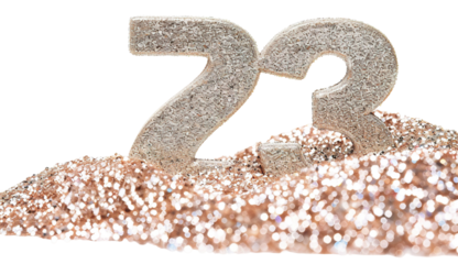 A bright number 73 stands out against a background of glitter dust. The number has a glittery texture and sits on a mound of sparkling dust. The scene is clear and eye-catching