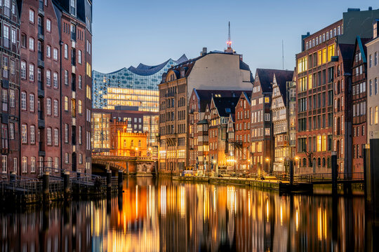 Hamburg Nikolaifleet historic canal at blue hour with reflections and city lights