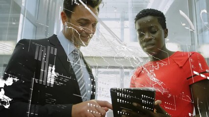 Animation of data processing over diverse businessman and businesswoman using digital tablet - Powered by Adobe