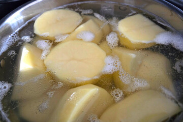 Raw Potatoes in Water for Cooking Preparation