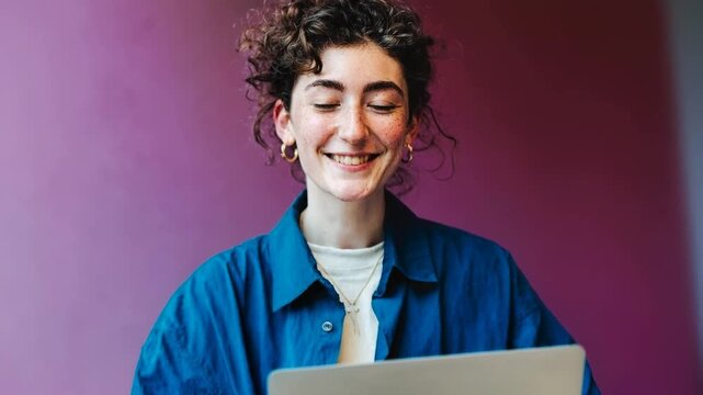 Friendly smiling person looking at camera in colorful studio portrait representing openness creativity modern communication and positive human connection