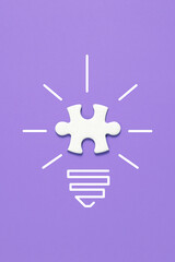 creative light bulb with puzzle pieces