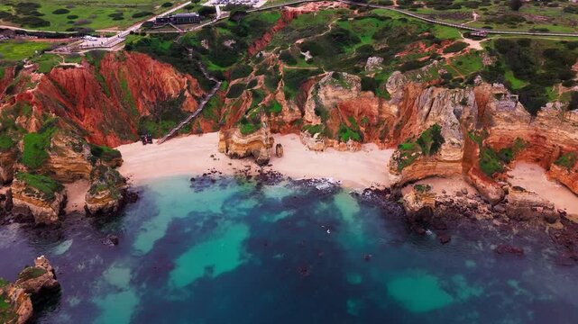 Aerial view of Praia do Camilo Beach and Cliffs in Lagos, Algarve, Portugal