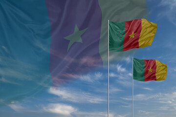 Card for Independence day National flags of Cameroon waving in sky