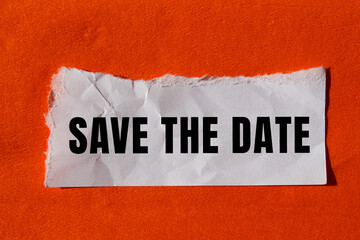 Save the date message written on ripped torn paper background. Conceptual Save the date symbol....