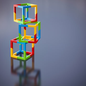 Colorful geometric cubes stacked symbolizing balance and teamwork