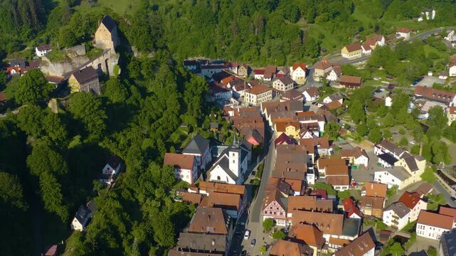 Panoramic aerial view of the old town and city Pottenstein in Germany on a sunny morning in spring. 
