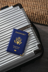 United States passport  and modern suitcase, travel preparation still life with luggage and international journey concept
