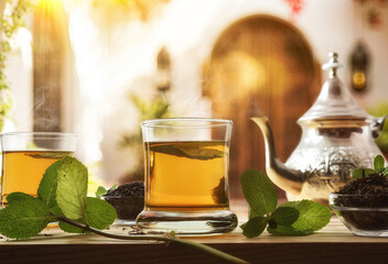 Moroccan tea on wooden table on a traditional terrace