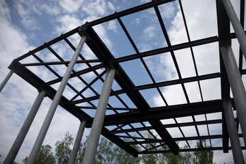 Roof without roof. Roof frame. Frame of beams over the stadium.