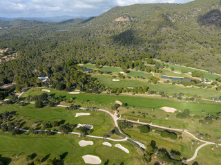 Aerial view, Spain, Balearic Islands, Mallorca, Capdepera, Cuevas de Arta and Platja de Canyamel with golf course, sand bunker, green, golfer