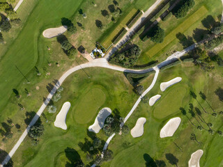 Aerial view, Spain, Balearic Islands, Mallorca, Capdepera, Cuevas de Arta and Platja de Canyamel with golf course, sand bunker, green, golfer