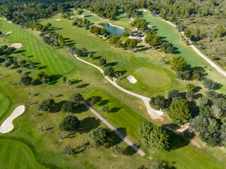 Aerial view, Spain, Balearic Islands, Mallorca, Capdepera, Cuevas de Arta and Platja de Canyamel with golf course, sand bunker, green, golfer