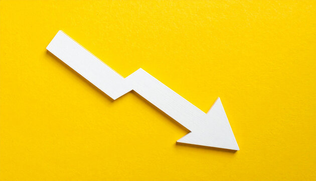 Minimalist white wooden downward arrow on yellow backdrop. Business decline, economic warning