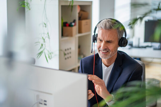 Businessman attending online meeting at office