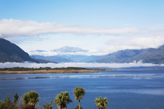 Morning clouds over Lake Brunner and mountains in New Zealand