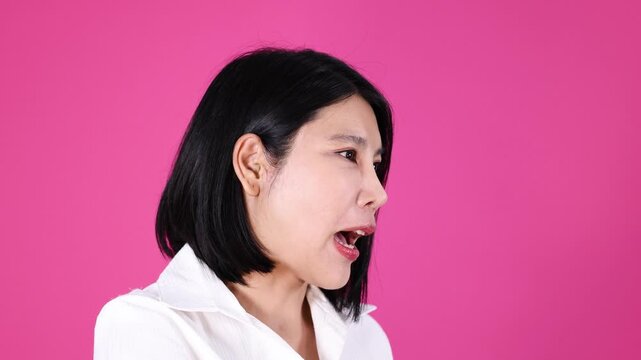 Woman Expressively Talking and Gesturing in Profile on Pink