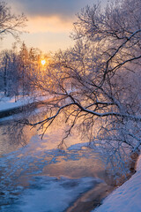 A frosty dawn by the river in a city park in Minsk