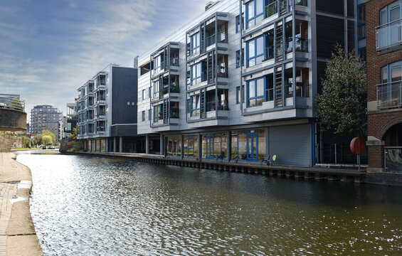 Exterior of brick Flats house object on Regents Canal in London, England. Real estate, residential apartments and offices. Living apartments or office building architecture