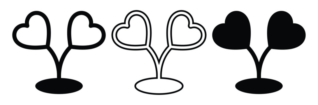 Heart shaped leaves on tree branches in black and white,hearten tree Black Silhouette.Heart shaped leaves on plants in different styles and colors