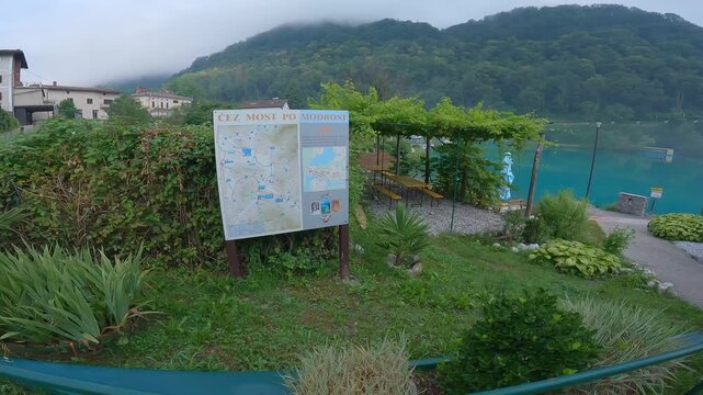 Outdoor tourist map board by the turquoise lake in Most na Soci Slovenia