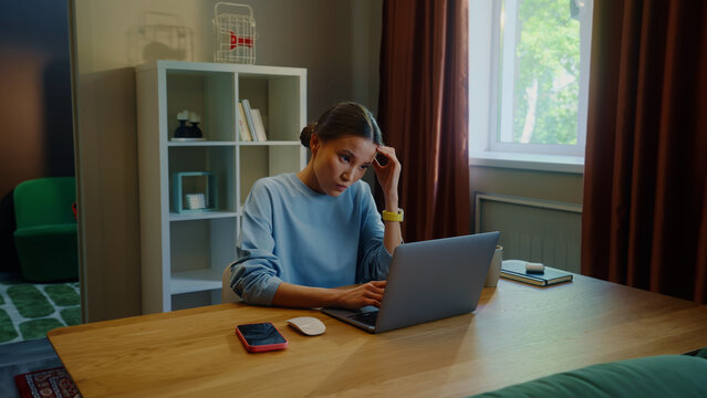 Angry asian woman work laptop home. Girl fail task. Female employee failure. Busy person use broken pc. Online computer freelance distant remote job. Worker ruined career, loss start up money. Bad day