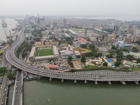 Aerial view of the vibrant Tafawa Balewa Square and surrounding buildings, a bustling intersection of roads and bridges against the vast cityscape, Lagos, Lagos, Nigeria.