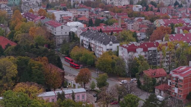 Drone flight over a busy road in Ni&scaron;, Serbia, revealing the cityscape as traffic flows through the urban landscape.