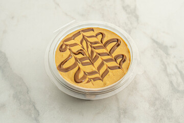 cakes, some taller than others, with simple decorations around the edges made with a fork or fingers, before going into the oven.