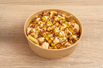 chunks of skin-on potatoes, bathed in a creamy cheese sauce and topped with crispy bacon bits and freshly chopped chives