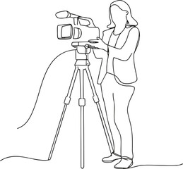 Woman operating a video camera on a tripod stand