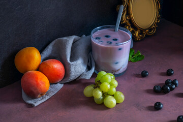 The art of food styling applied to fruit: a still life where strawberries are arranged in an ascending spiral, raspberries create a winding path, and a beet