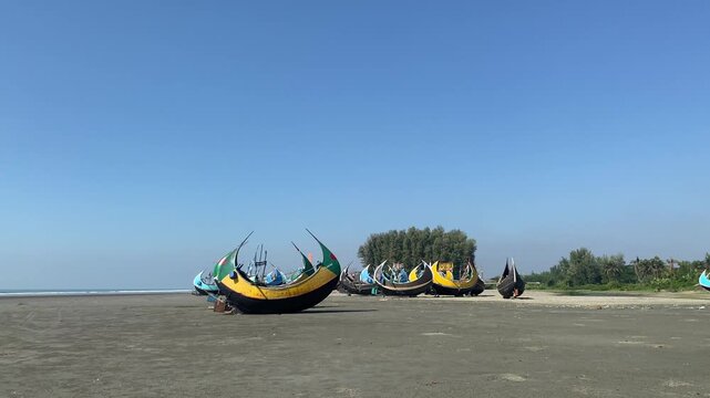 Sampan Boat on the Beach - Coastal Simplicity and Tradition. A traditional sampan boat rests quietly on the beach, reflecting the timeless bond between coastal life and the sea.