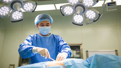 Surgeon performing operation in operating room