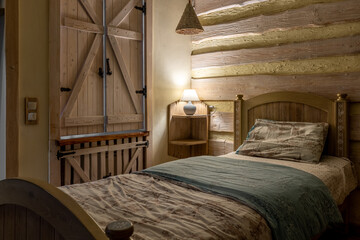 Rustic bedroom corner with log walls and wooden shutters
