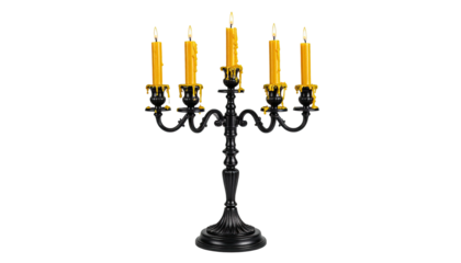 Ornate black candelabra with five lit yellow candles, isolated on black background