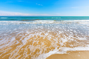 Wave crashes on the sand, seascape